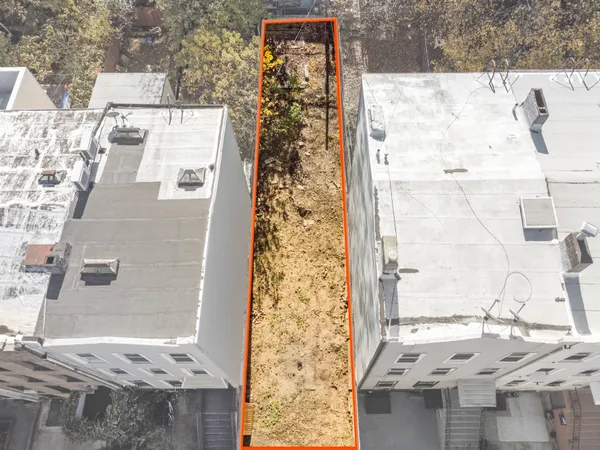 a view of a backyard of the house