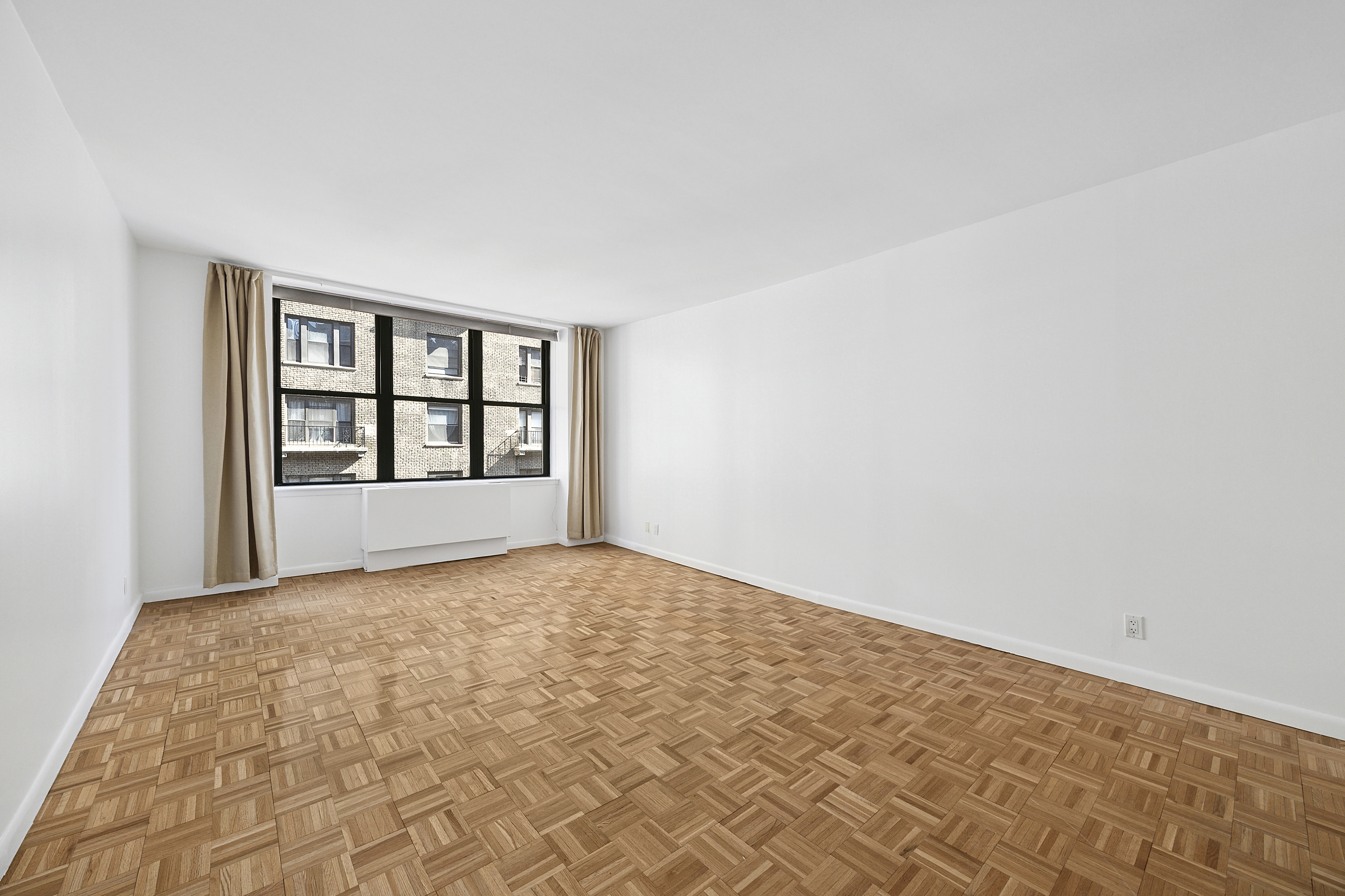 2250 Broadway, Unit 5H Manhattan, NY 10024 - Photo 3 of 9 a view of an empty room and window