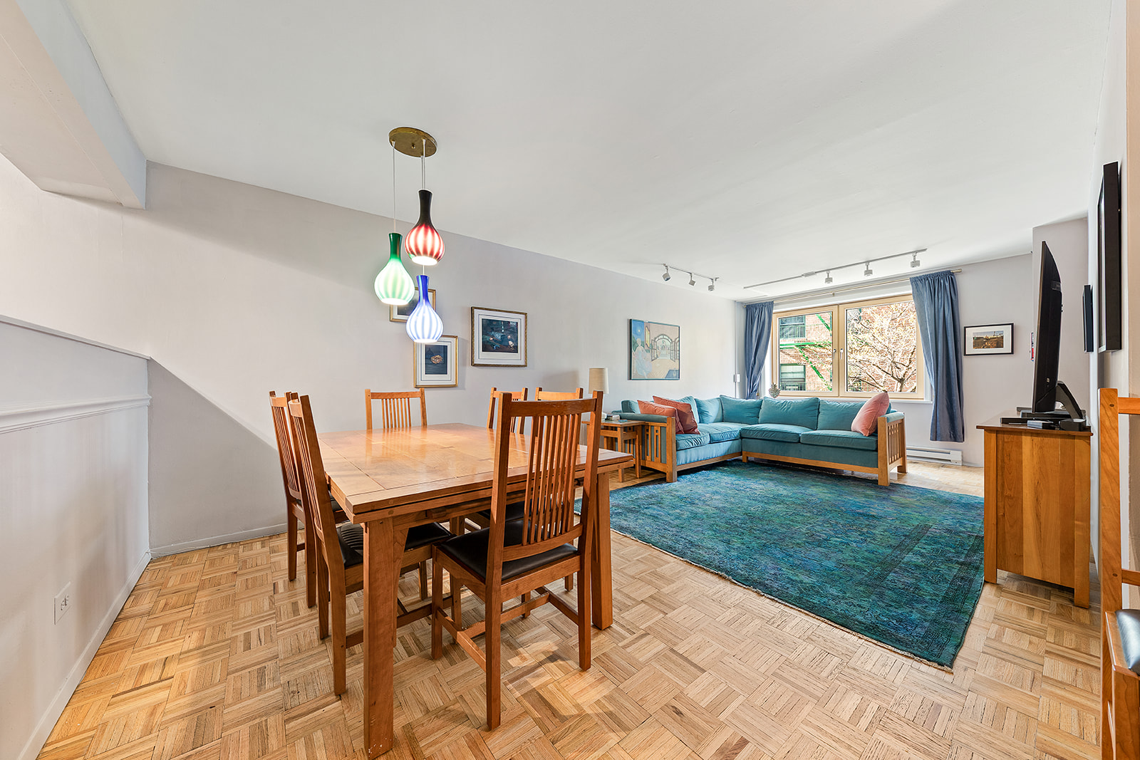 680 Washington Street, Unit 1B Manhattan, NY 10014 - Photo 3 of 13 a living room with furniture a rug and a window