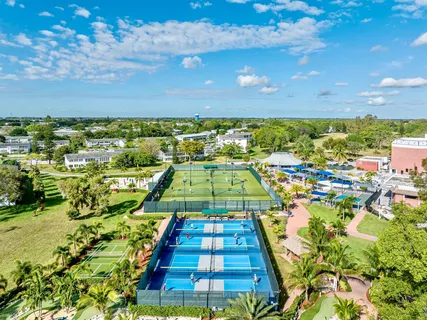 a view of a swimming pool and an outdoor seating