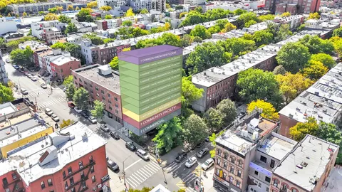 an aerial view of a houses with outdoor space