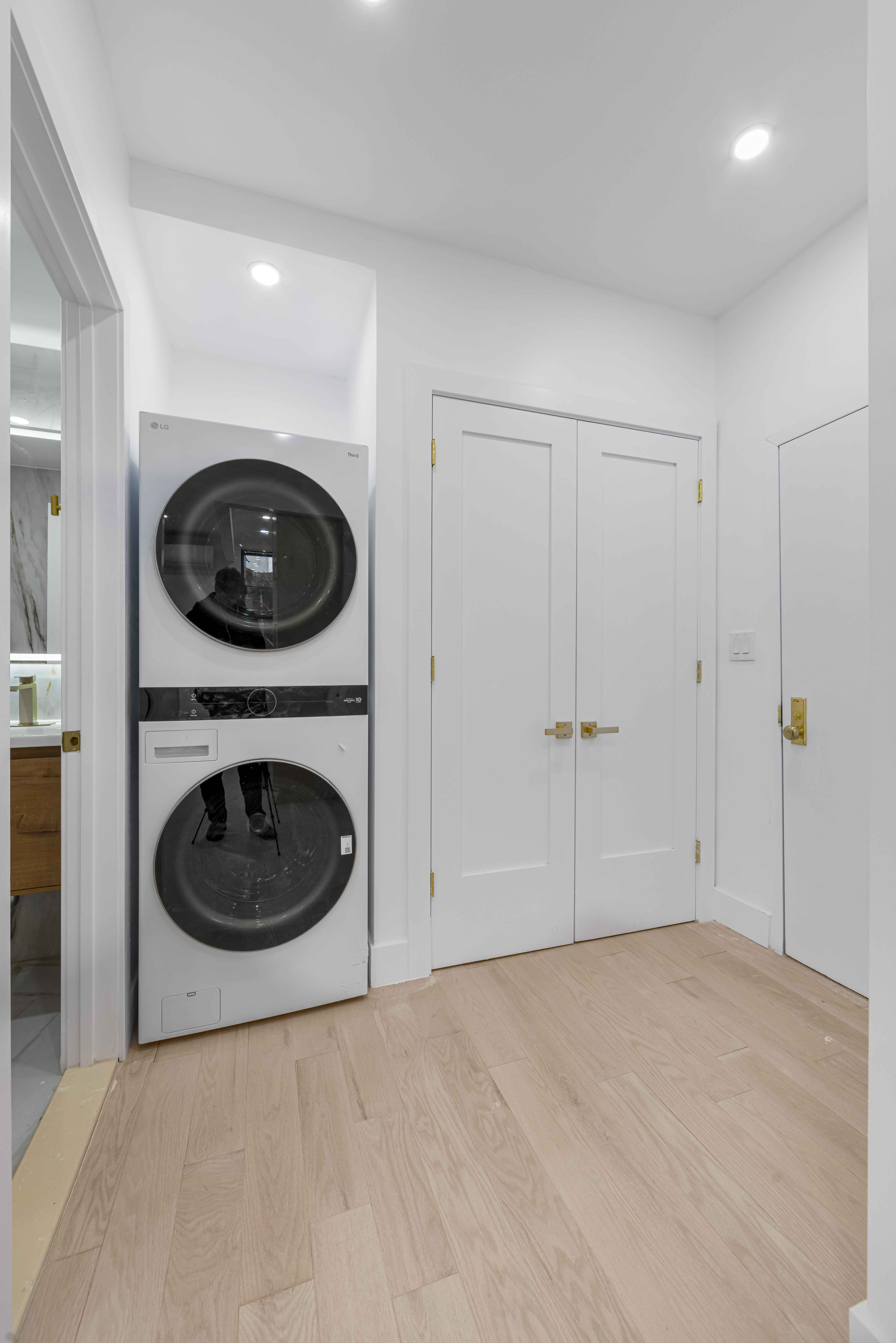 204 Flatbush Avenue, Unit 3L Brooklyn, NY 11217 - Photo 7 of 8 a view of a room with a washer and dryer