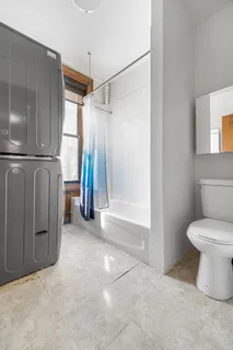 a bathroom with a shower and a toilet