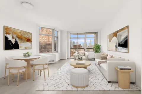 a living room with furniture a flat screen tv and a large window