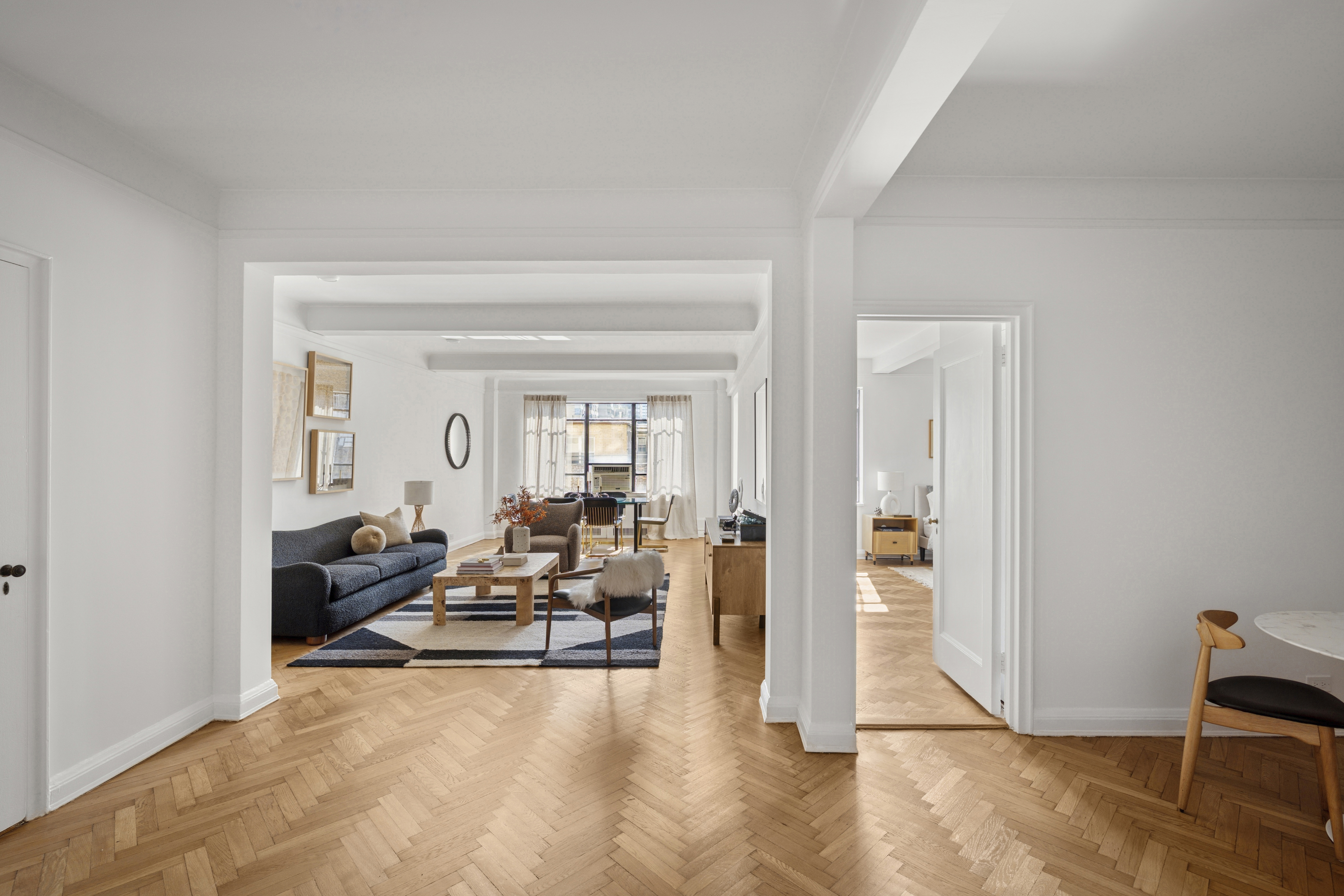 140 Riverside Drive, Unit 10N Manhattan, NY 10024 - Photo 6 of 21 a living room with furniture and a window