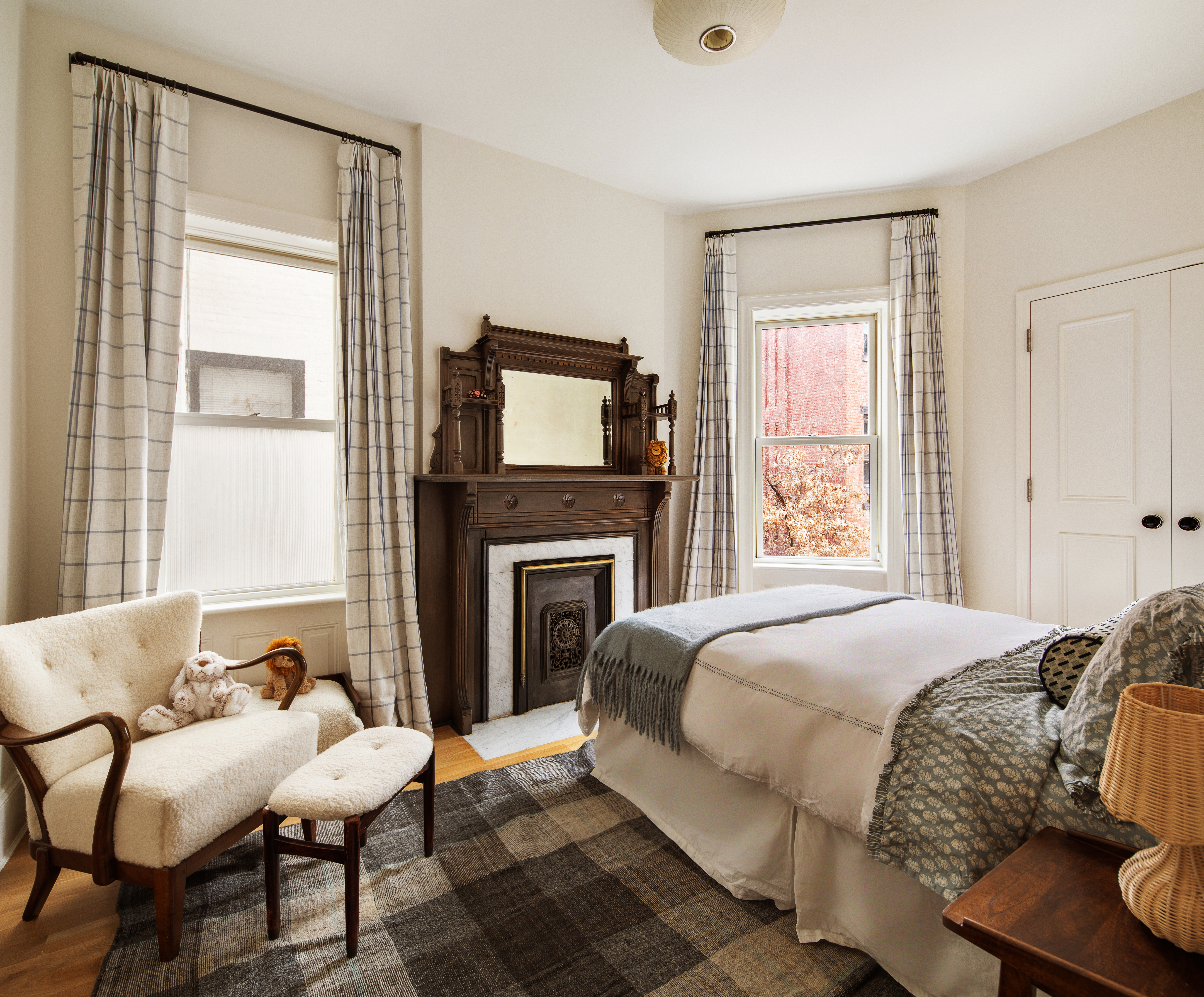 27 7th Avenue Brooklyn, NY 11217 - Photo 18 of 23 a bedroom with a bed and a fireplace