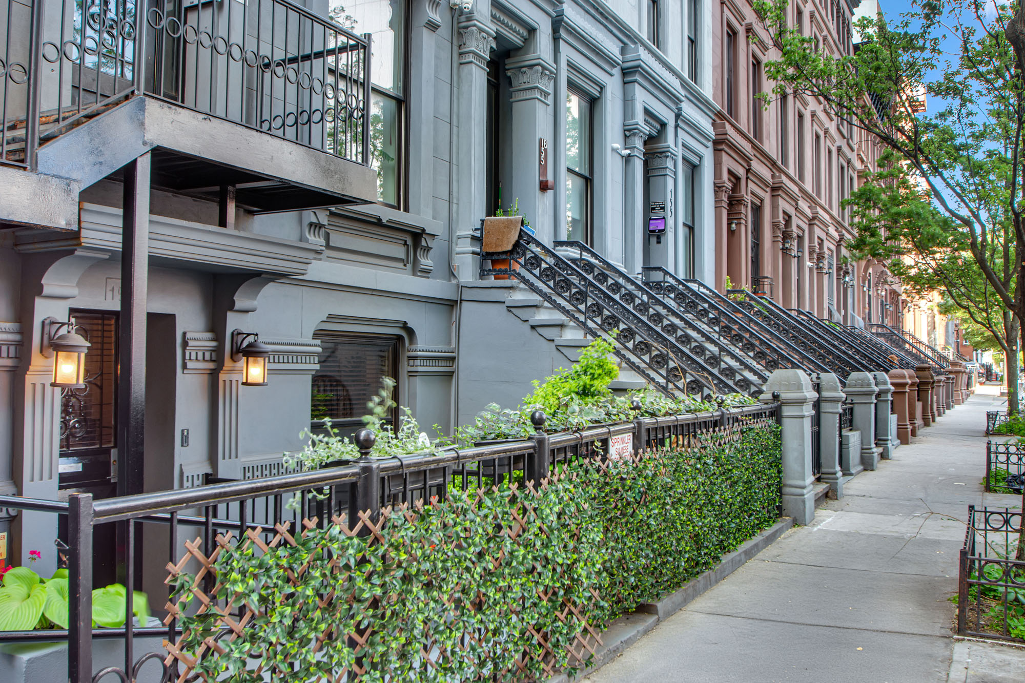 159 West 126th Street, Unit GARDEN A Manhattan, NY 10027 - Photo 13 of 15 an outdoor view of a house with a street