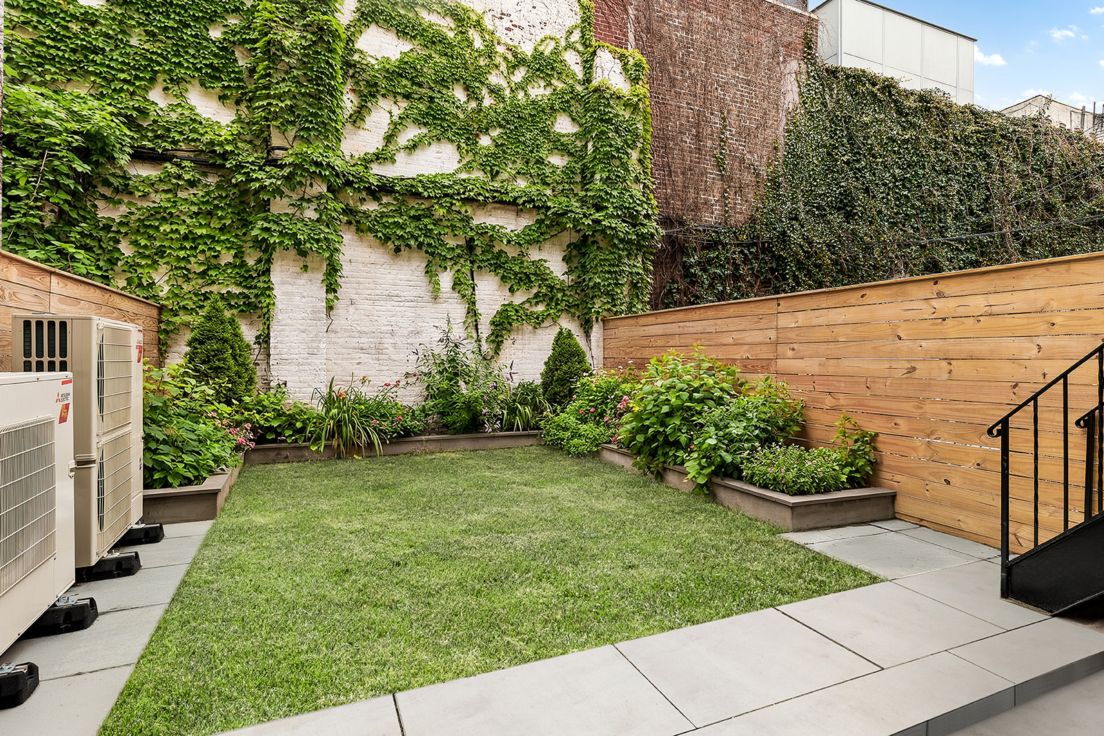 109 2nd Place Brooklyn, NY 11231 - Photo 23 of 26 a view of a backyard with potted plants and large trees