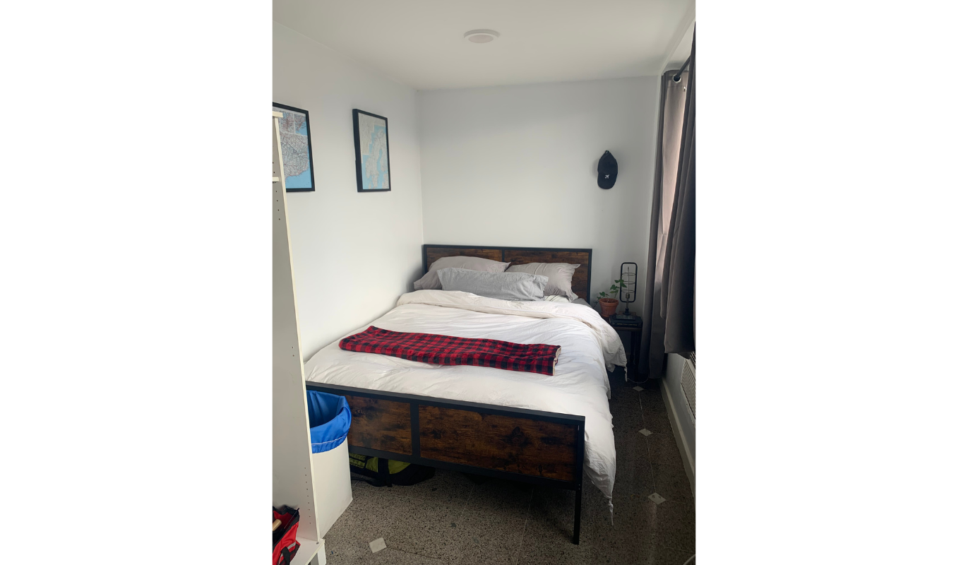 77 Allen Street, Unit 7A Manhattan, NY 10002 - Photo 1 of 1 a bedroom with a bed and a table