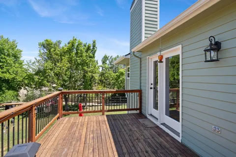 a view of outdoor space with wooden floor and outdoor seating