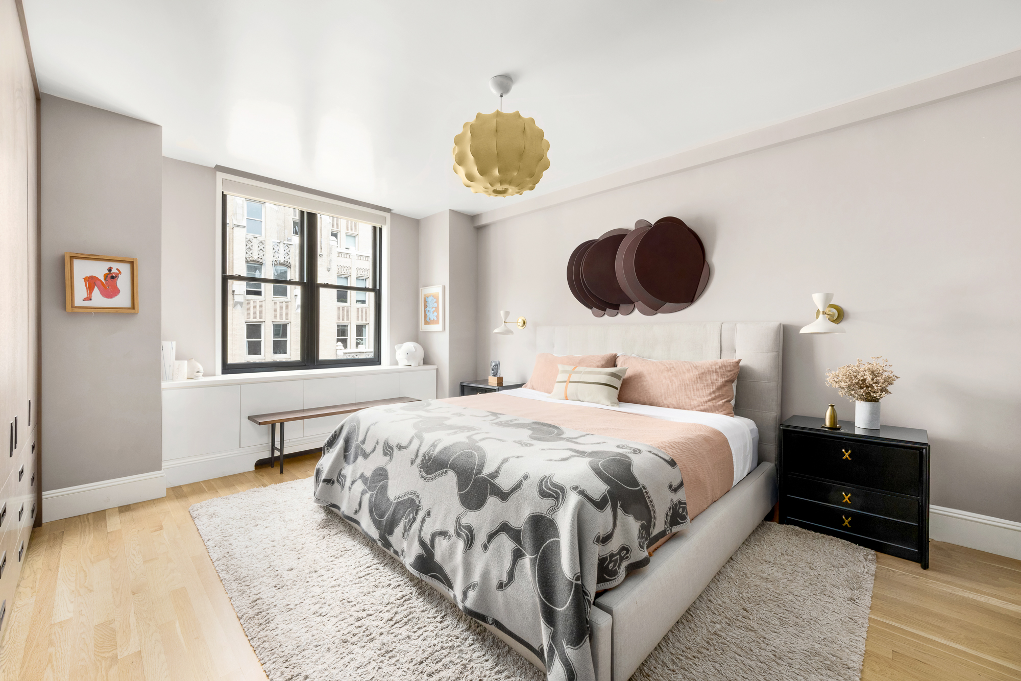 220 Madison Avenue, Unit 14/15O Manhattan, NY 10016 - Photo 12 of 18 a bedroom with a bed and a chandelier