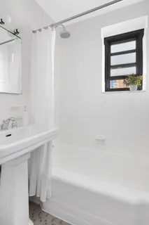a bathroom with a sink and a bathtub
