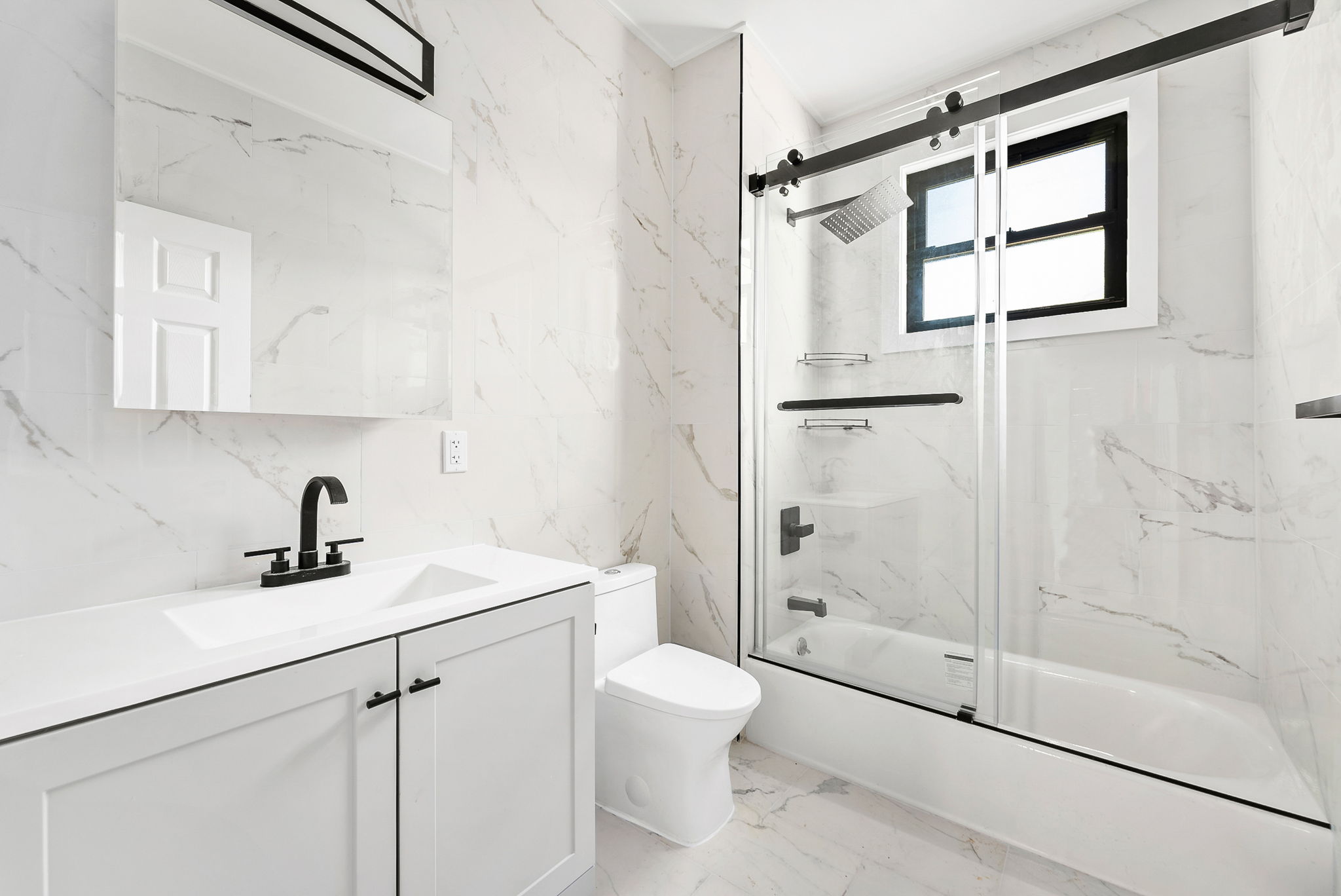 1414 30th Road Queens, NY 11102 - Photo 8 of 16 a bathroom with a shower sink vanity mirror and toilet