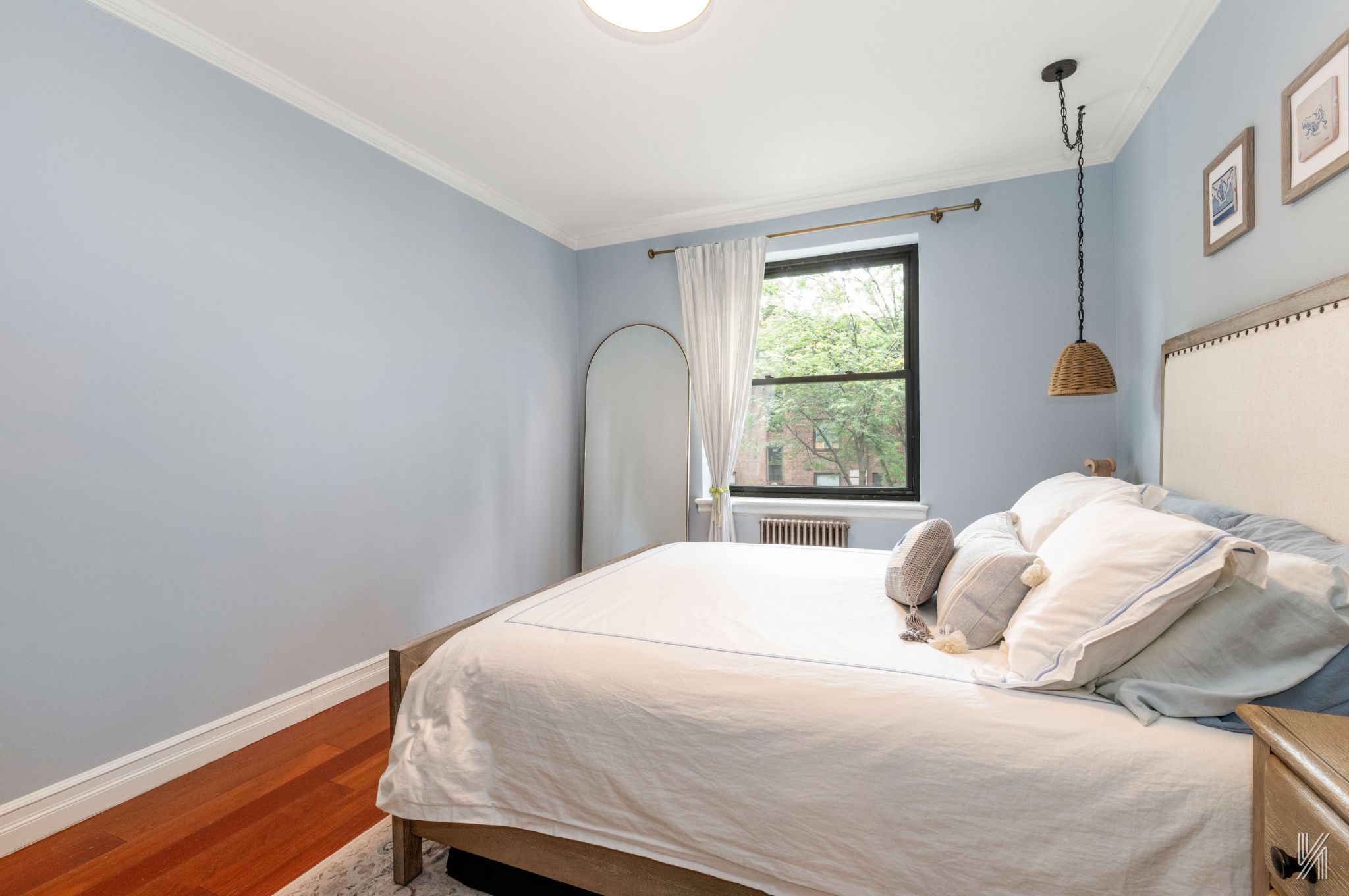 22-31 77th Street, Unit C2 Queens, NY 11370 - Photo 12 of 17 a bedroom with a bed and a window