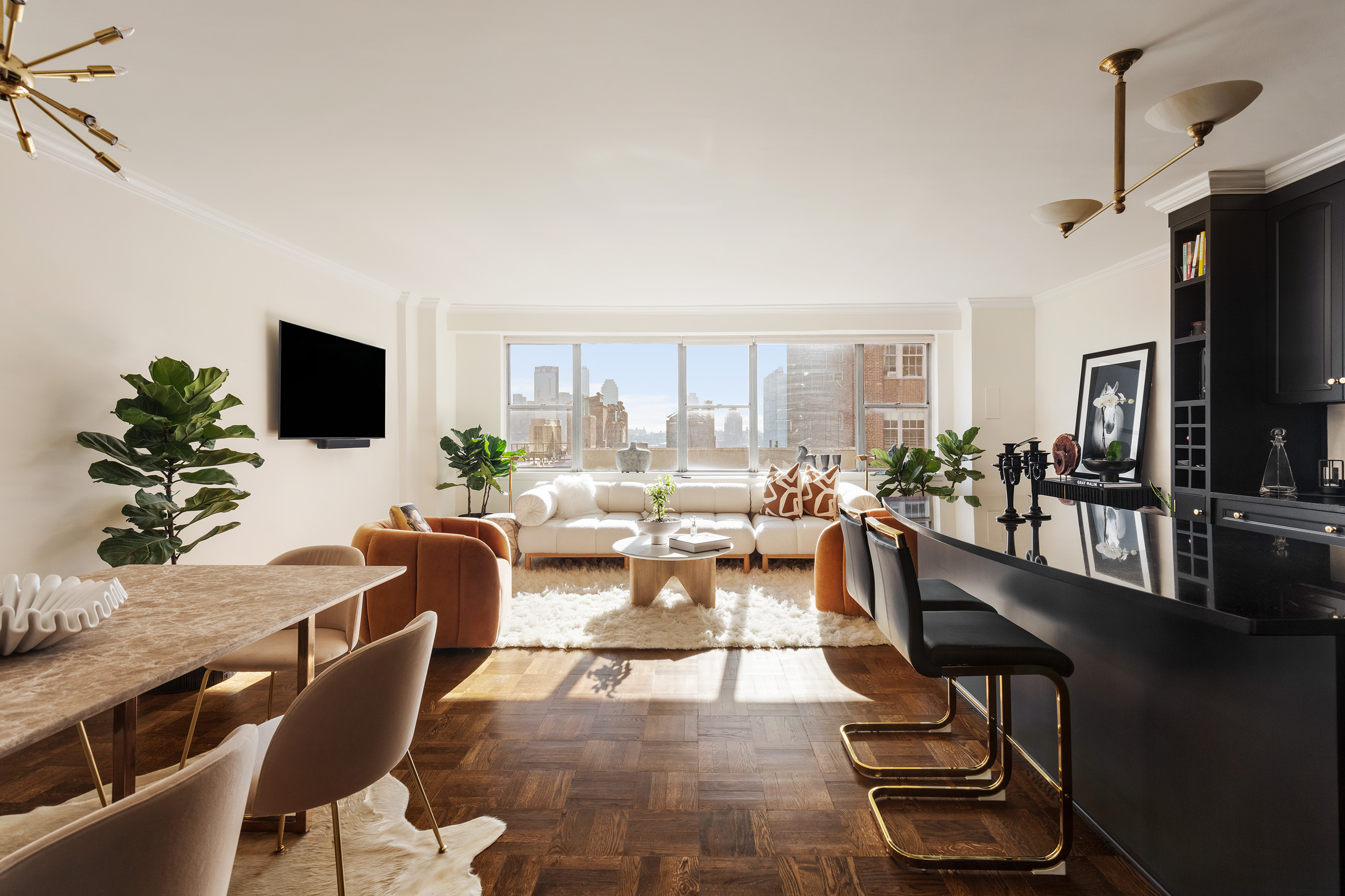 12 Beekman Place, Unit 7/8B Manhattan, NY 10022 - Photo 6 of 17 a living room with fireplace furniture and a flat screen tv