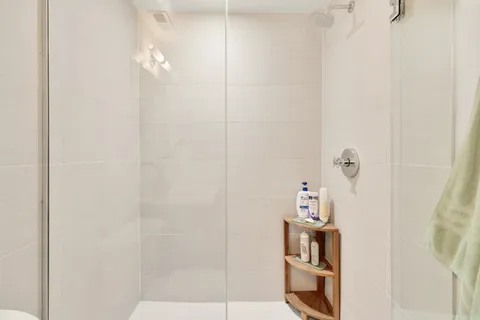 a view of a balcony with table and chairs