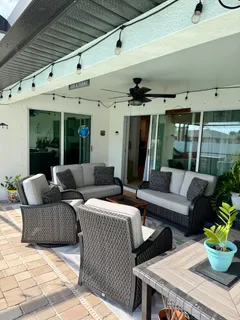 a outdoor space with patio the couches and a potted plant