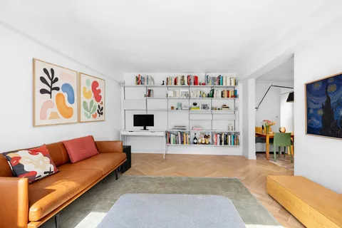 a living room with furniture and a couch