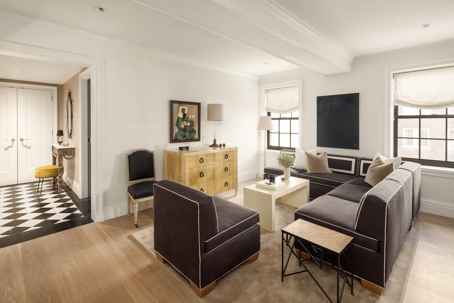 118 West 13th Street, Unit 3 Manhattan, NY 10011 - Photo 5 of 26 a living room with furniture and a flat screen tv