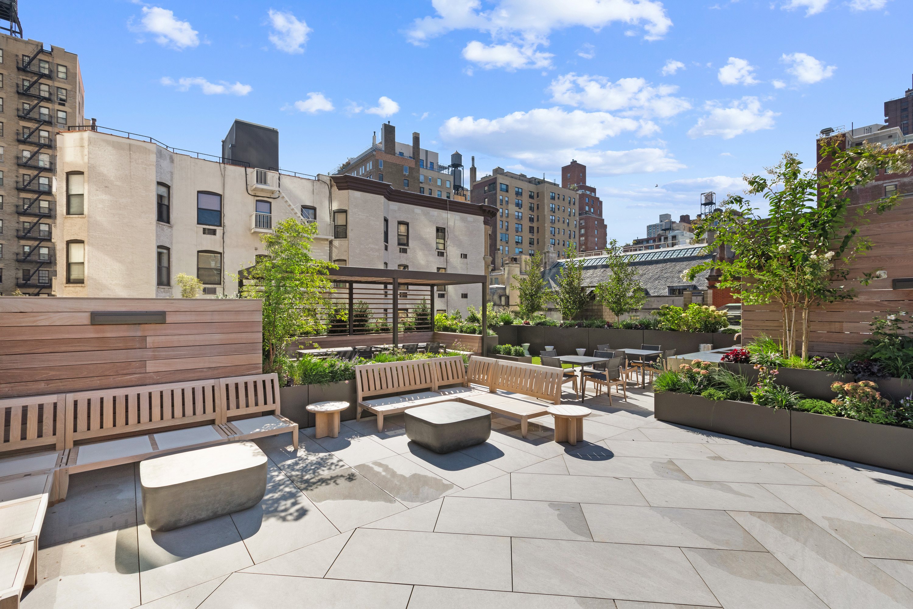 40 East 94th Street, Unit 13G Manhattan, NY 10128 - Photo 10 of 13 a view of a patio with couches and potted plants
