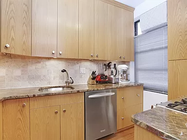 690 Riverside Drive, Unit 5C Manhattan, NY 10031 - Photo 4 of 12 a kitchen with stainless steel appliances granite countertop a sink stove and cabinets
