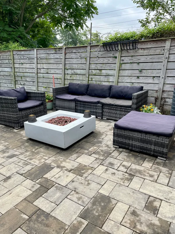 a view of a patio with couches and a table and chairs