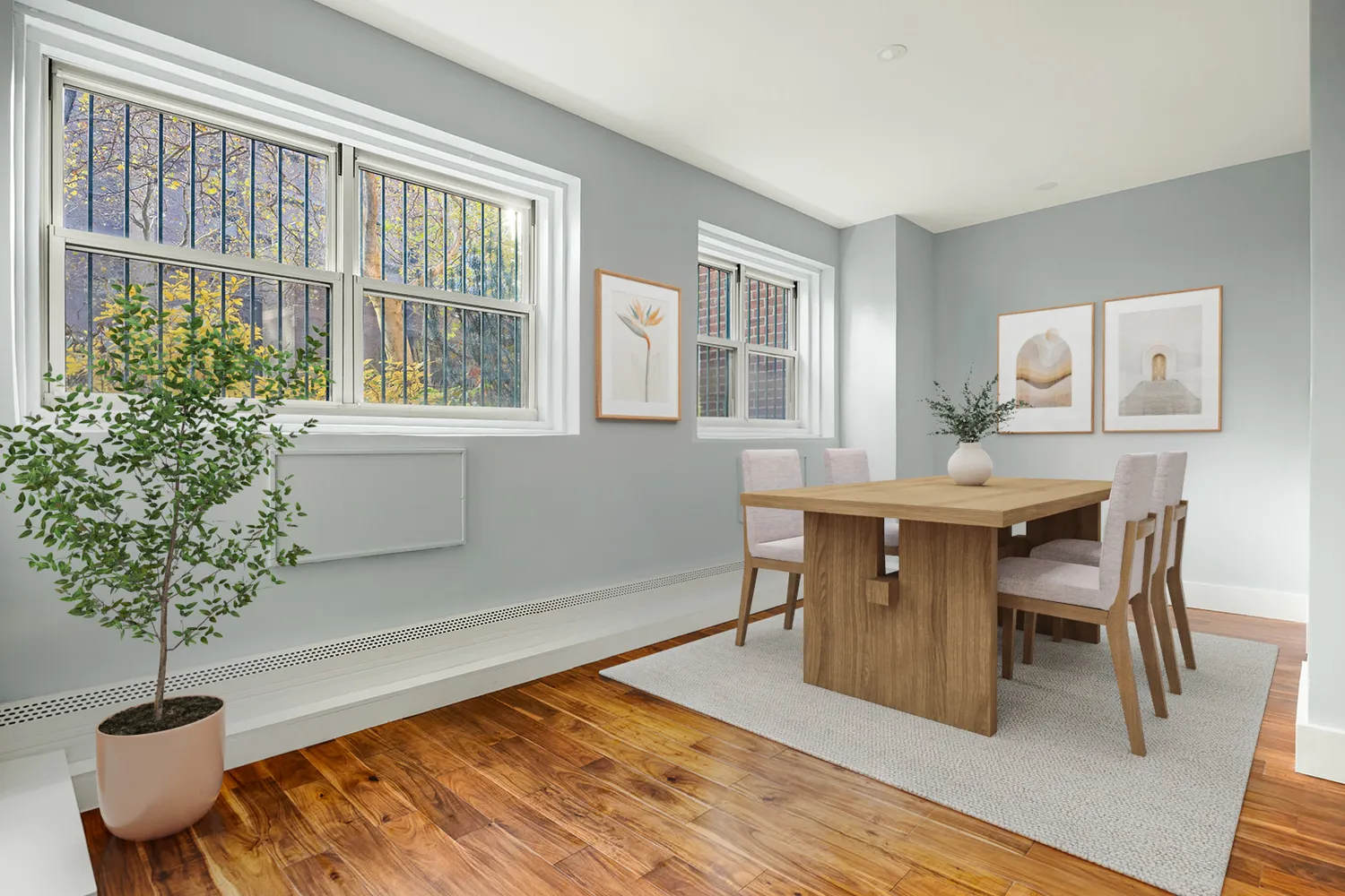 a view of a dining room with furniture window and wooden floor