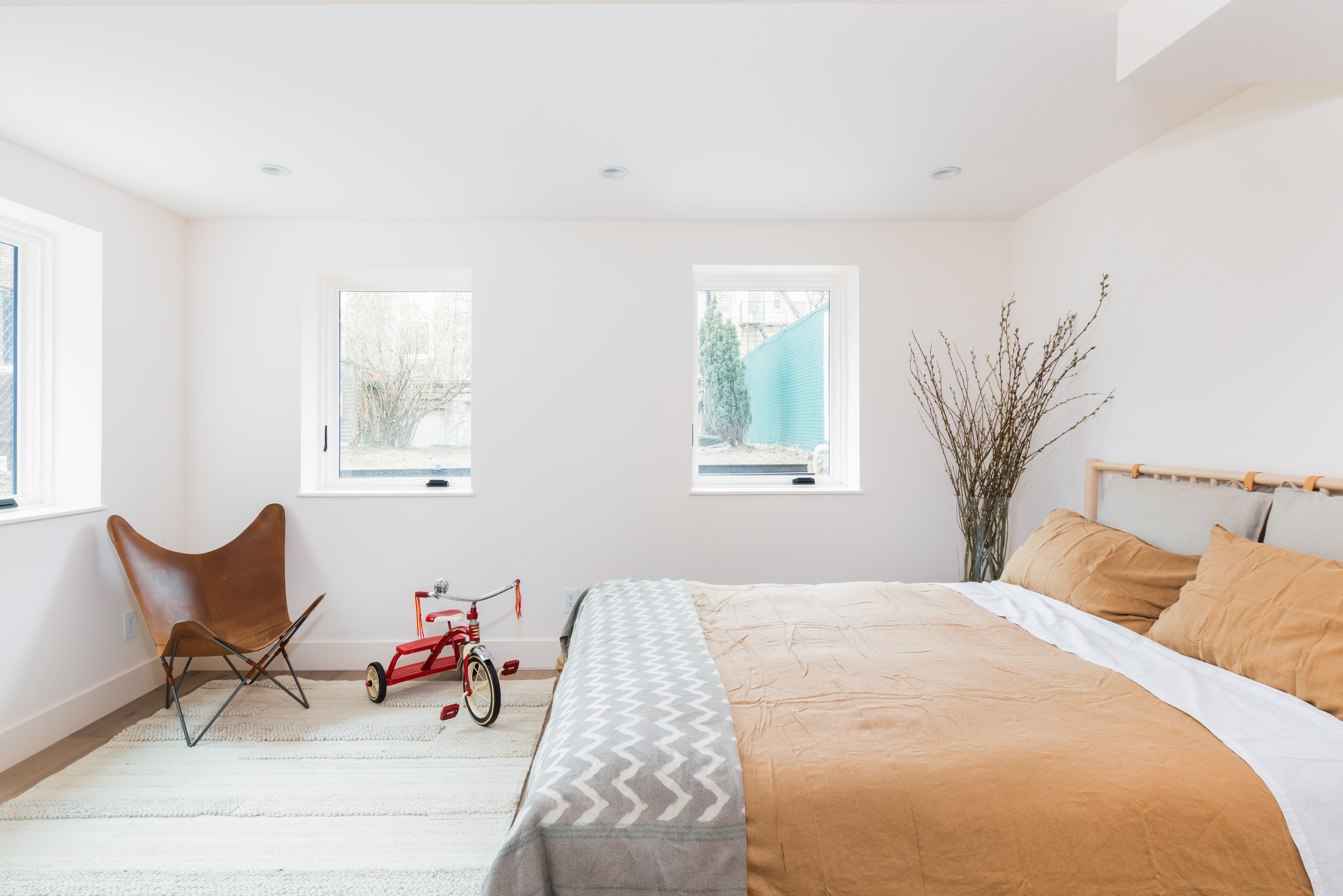 651 Leonard Street, Unit 1A Brooklyn, NY 11222 - Photo 5 of 12 a bedroom with furniture and a window