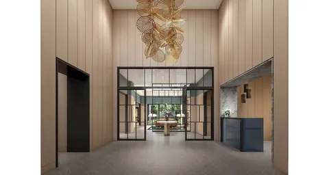 a view of hallway with furniture and a window