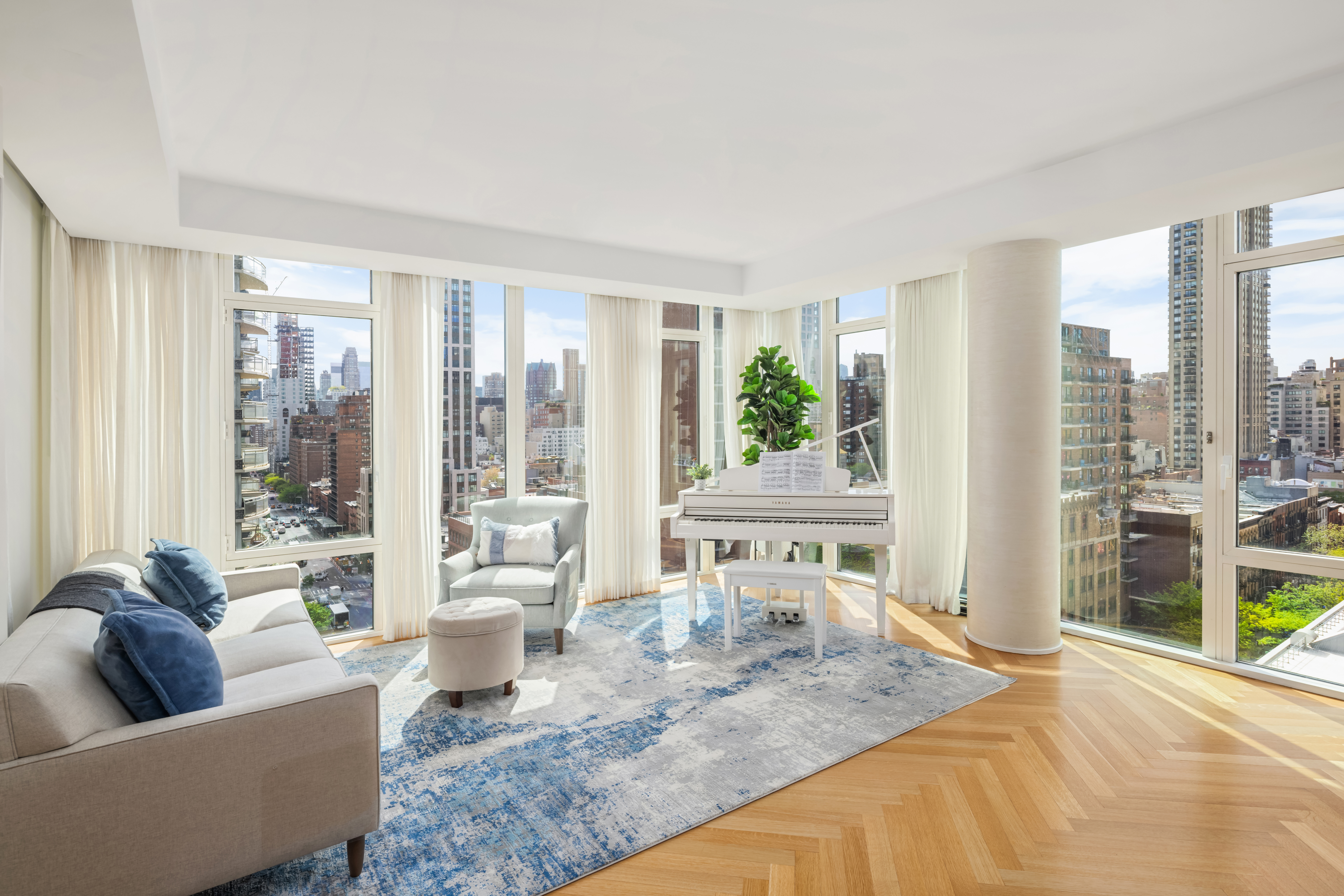305 East 85th Street, Unit 14D Manhattan, NY 10028 - Photo 2 of 11 a living room with furniture and a large window