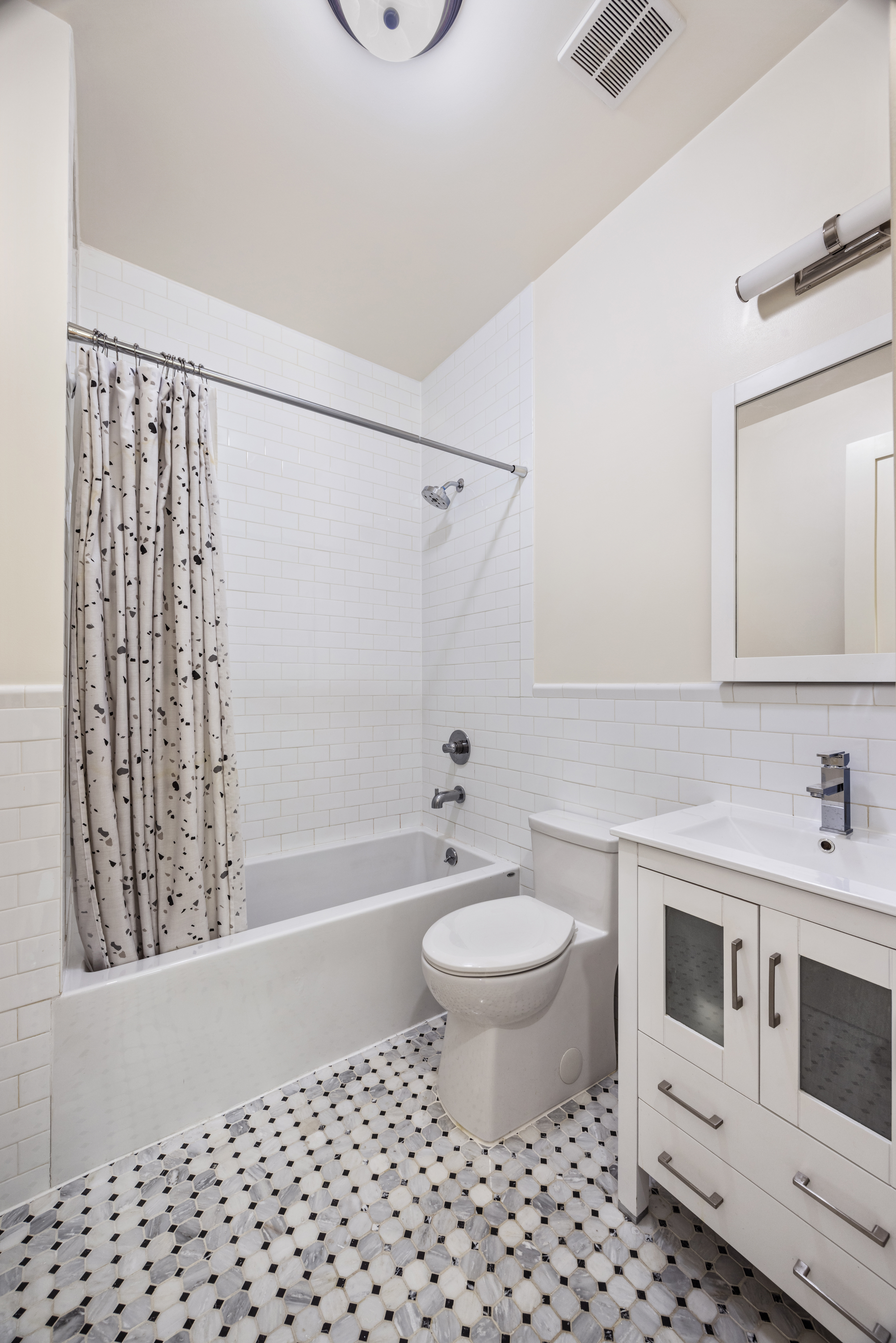 437 Putnam Avenue, Unit 2 Brooklyn, NY 11221 - Photo 7 of 9 a bathroom with a sink toilet a mirror and shower