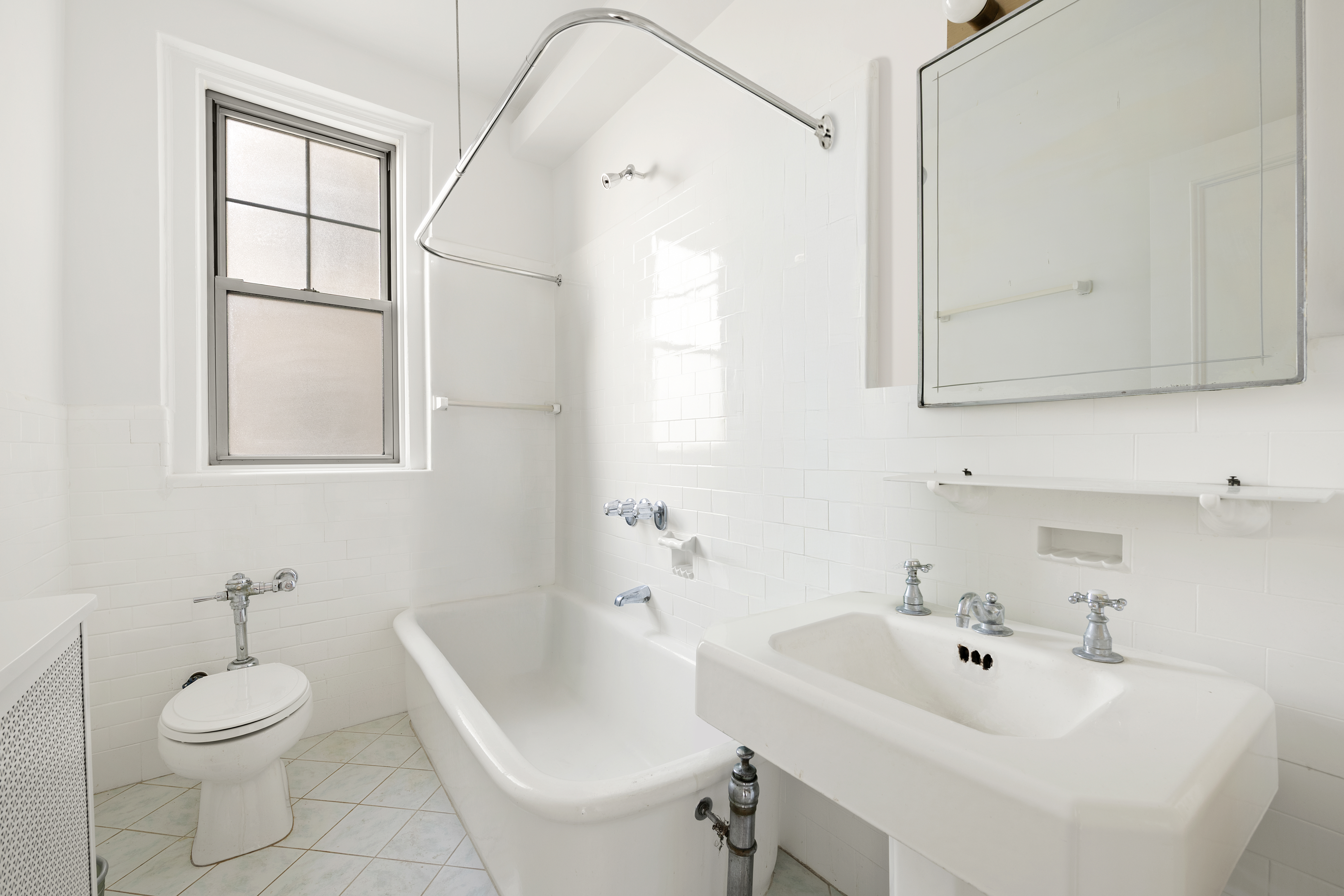 160 Riverside Drive, Unit 8A Manhattan, NY 10024 - Photo 8 of 15 a bathroom with a sink a toilet and shower