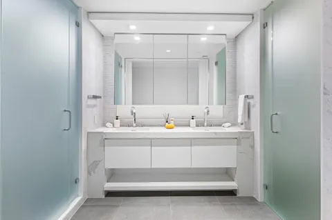 a bathroom with a sink and mirror