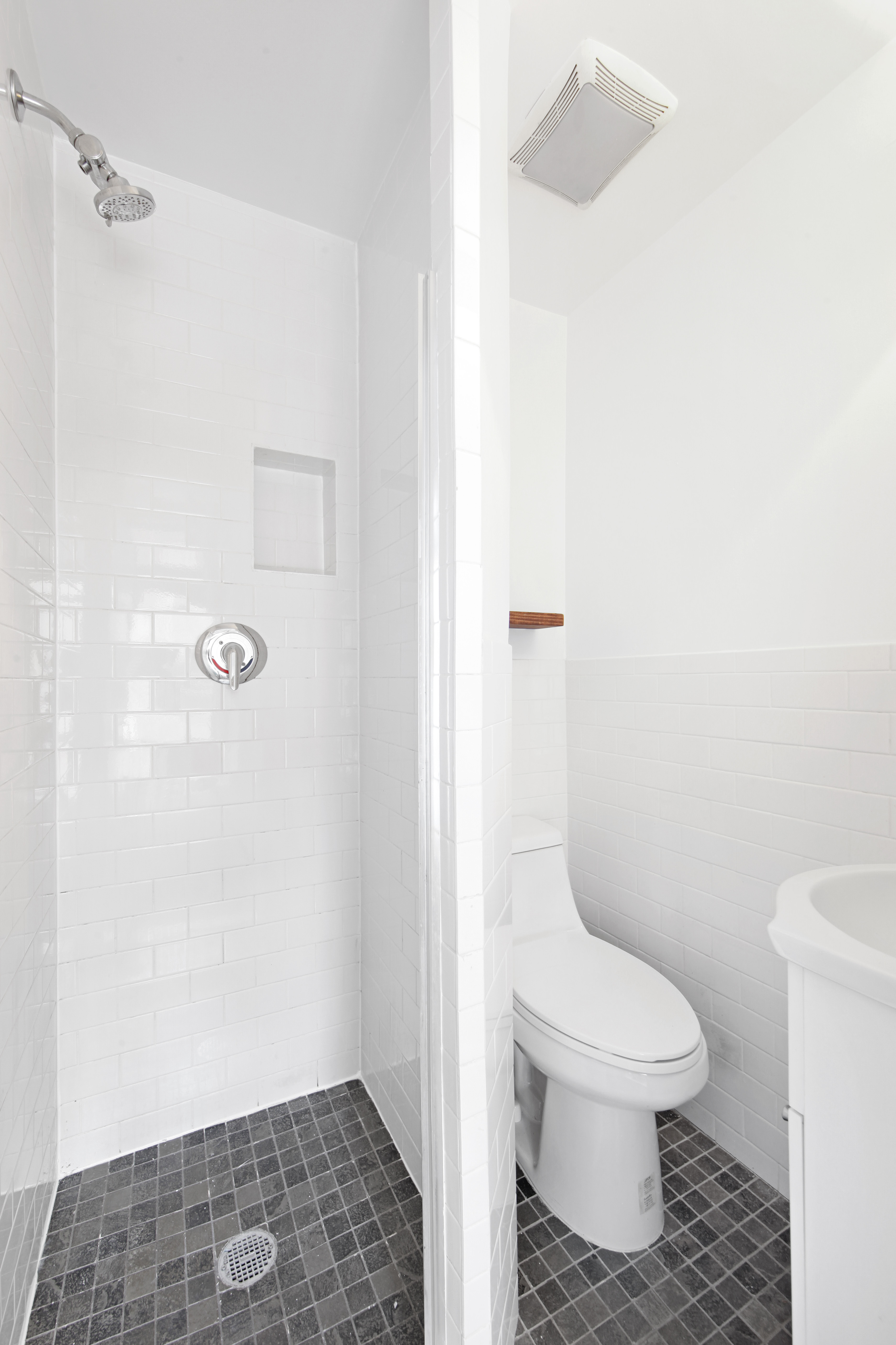 150 Sullivan Street, Unit 37 Manhattan, NY 10012 - Photo 7 of 12 a bathroom with a toilet and a shower