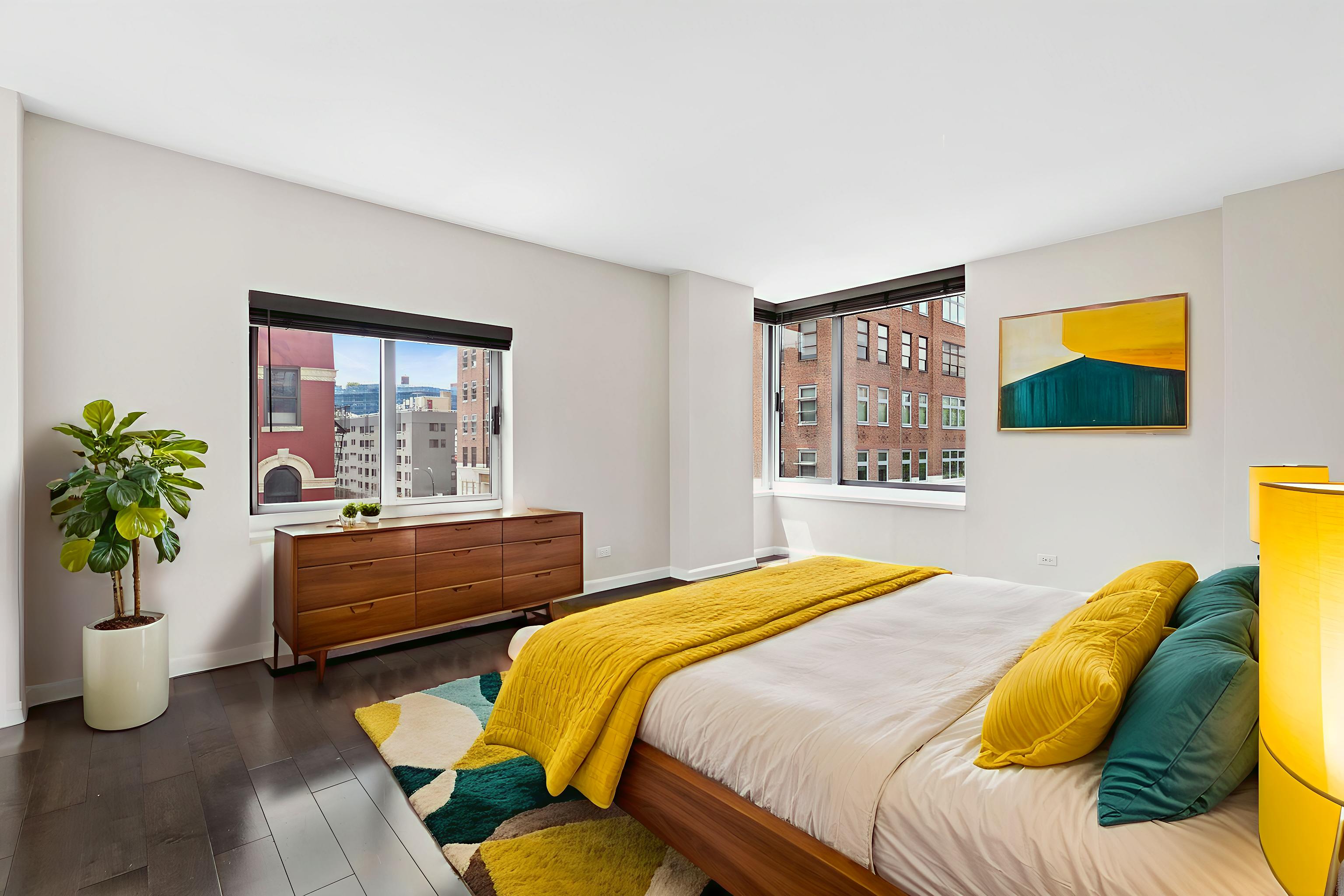 270 West 17th Street, Unit 4L Manhattan, NY 10011 - Photo 3 of 11 a bedroom with a bed and a window