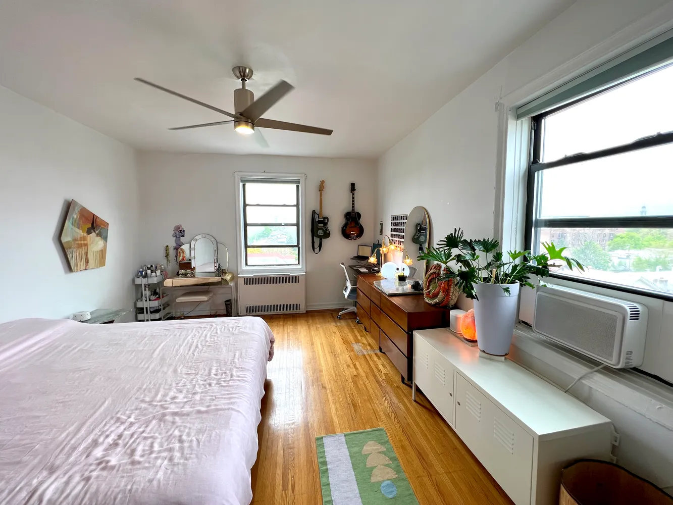 a bedroom with furniture and a window