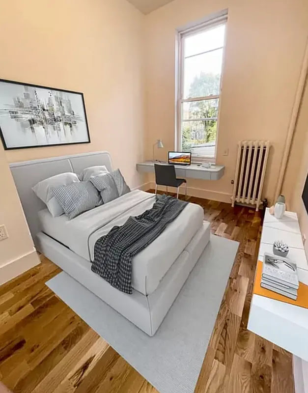 1128 Bushwick Avenue, Unit A Brooklyn, NY 11221 - Photo 9 of 14 a bedroom with a bed and wooden floor