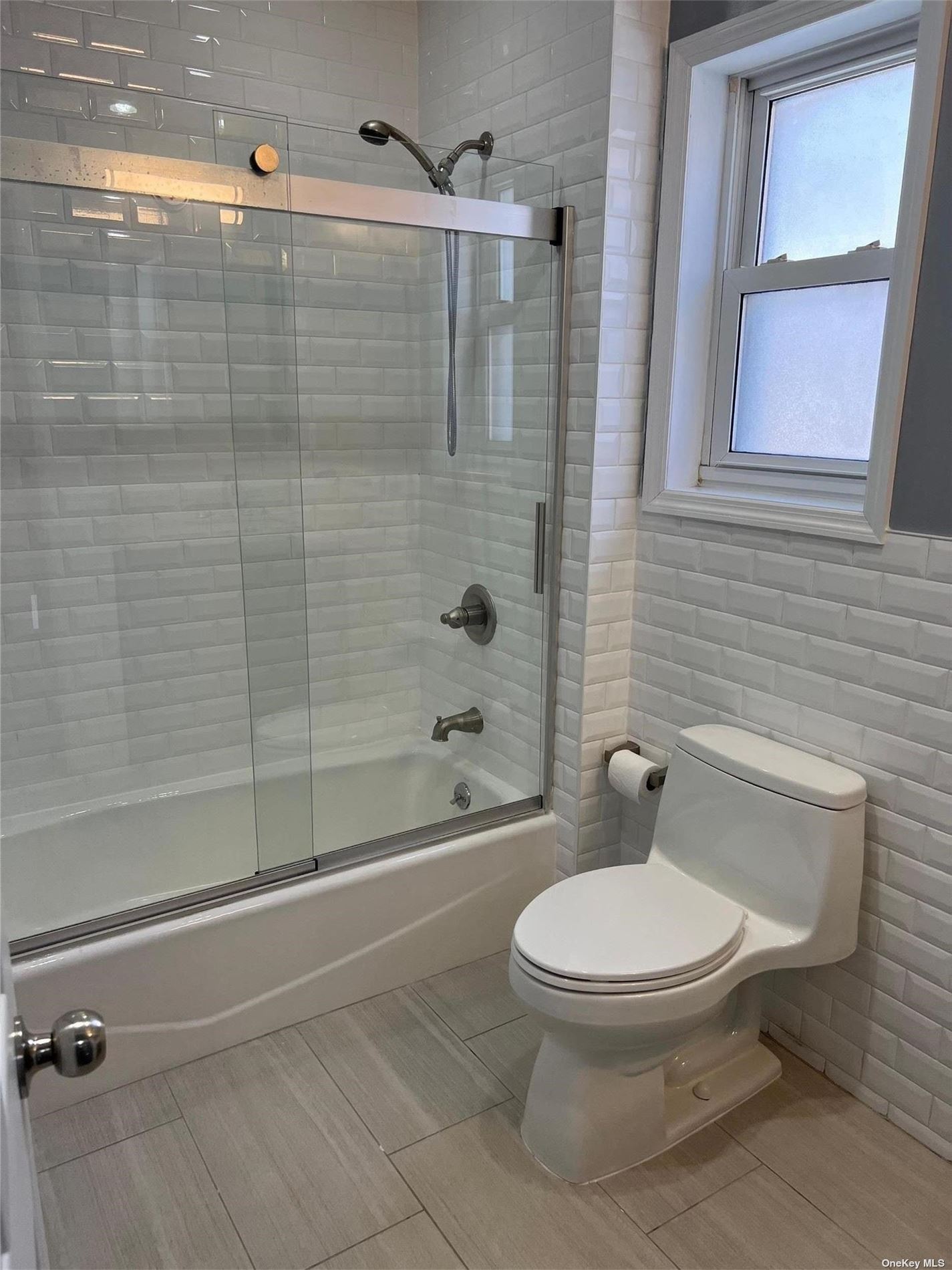 204-11 46th Avenue Queens, NY 11361 - Photo 6 of 7 a white toilet next to a bathroom sink