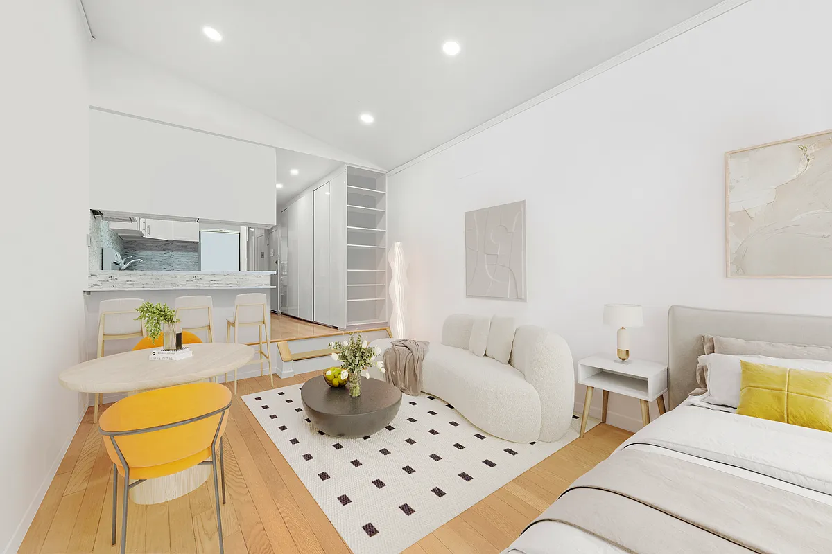 35 East 10th Street, Unit 2G Manhattan, NY 10003 - Photo 2 of 11 a living room with furniture and a couch
