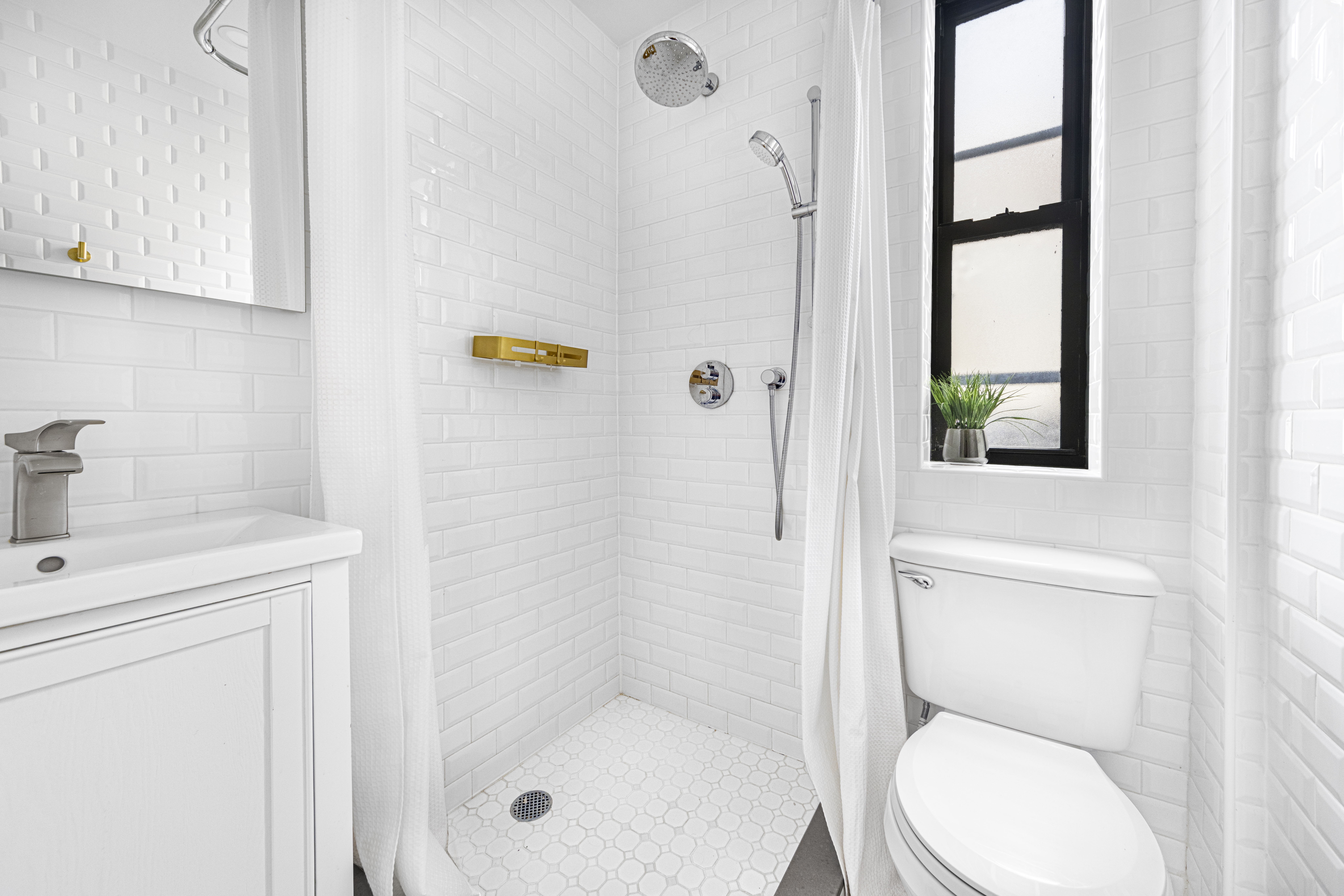 227 West 11th Street, Unit 43 Manhattan, NY 10014 - Photo 5 of 6 a bathroom with a toilet and a shower