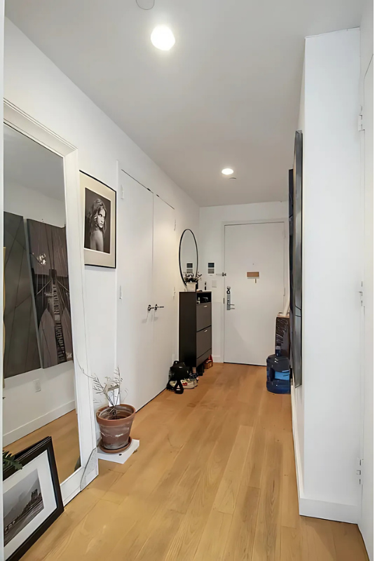 517 West 46th Street, Unit 307 Manhattan, NY 10036 - Photo 9 of 10 a room with gym equipment and wooden floor