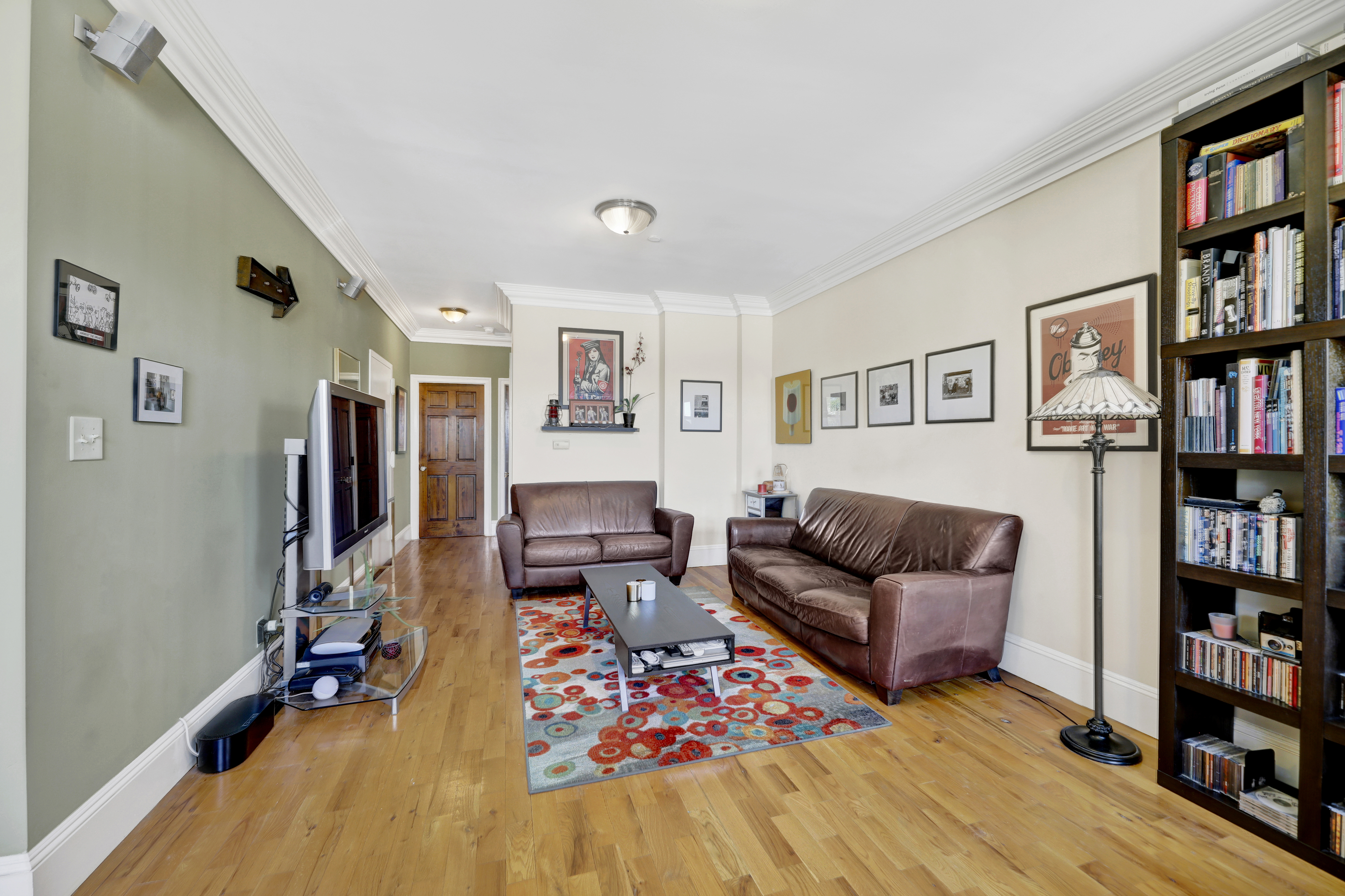 36 Russell Street, Unit 22 Brooklyn, NY 11222 - Photo 14 of 27 a living room with furniture and a book shelf