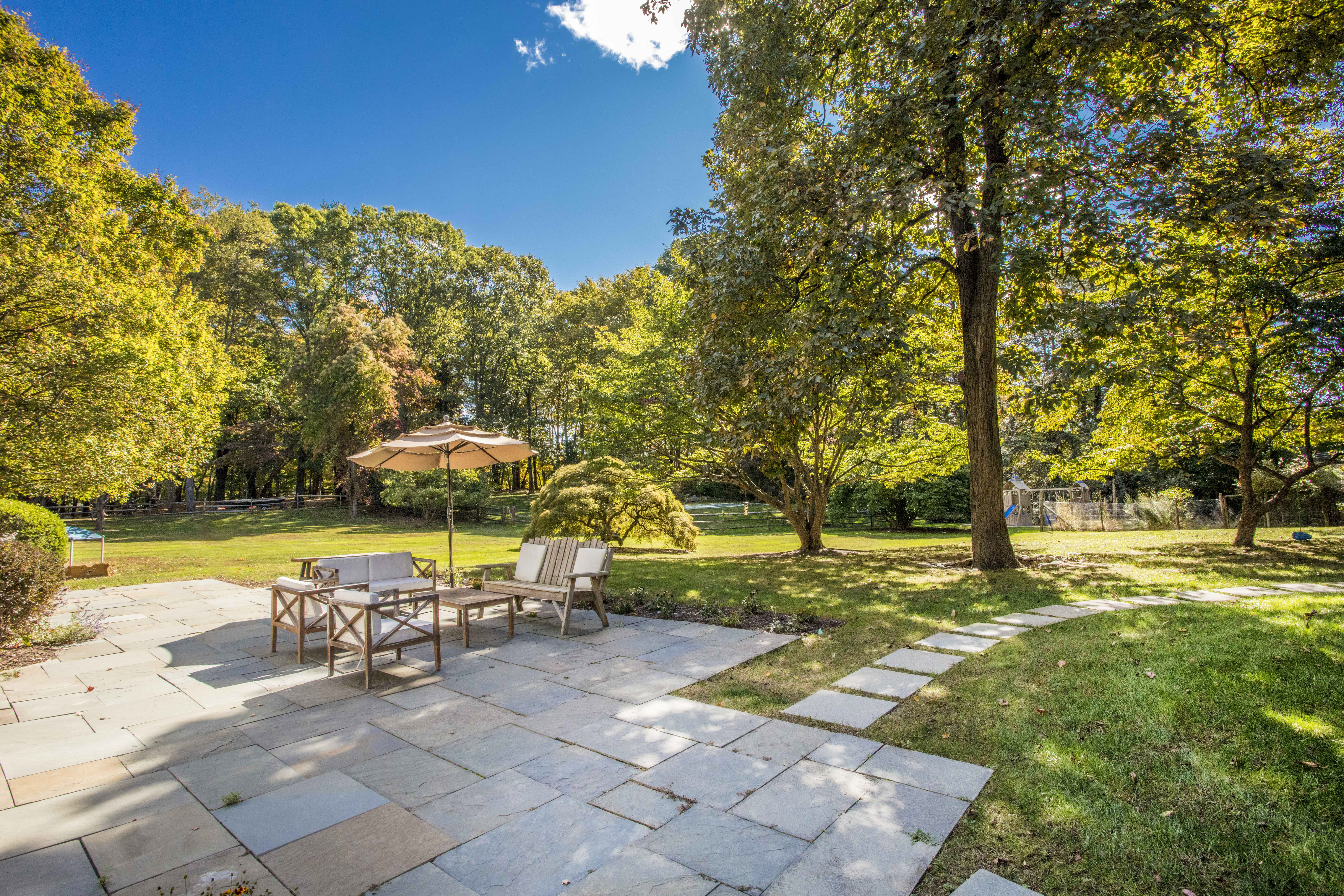 41 Harris Road Katonah, NY 10536 - Photo 36 of 48 a view of a swimming pool and lounge chairs