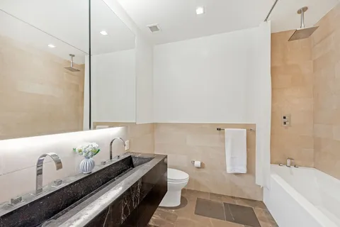 a bathroom with a bathtub and a toilet