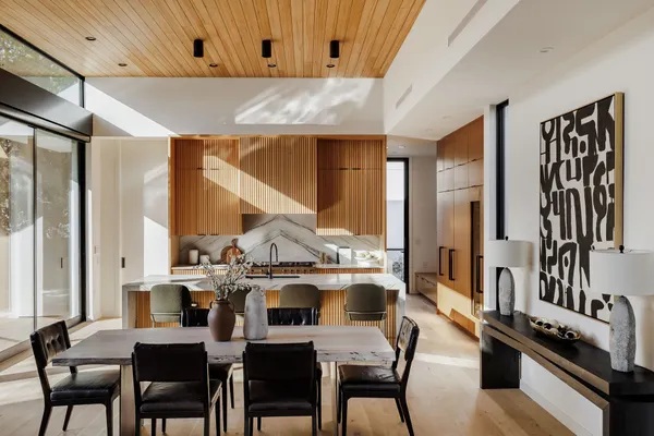 a view of a dining room with furniture and window