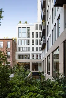 a view of a building next to a yard