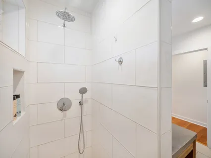 a kitchen with stainless steel appliances a stove a sink a microwave a refrigerator and a sink