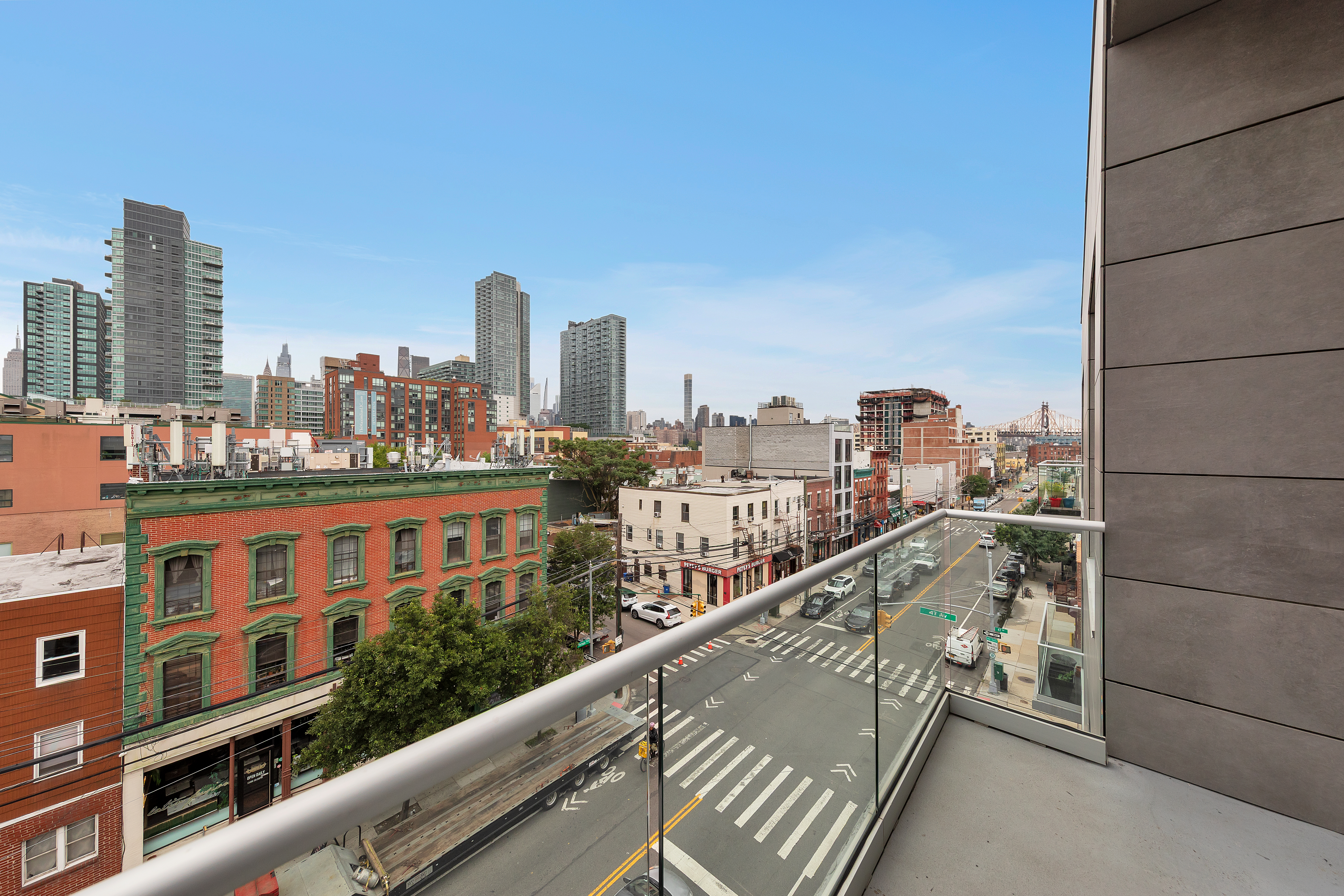 47-01 Vernon Boulevard, Unit 4E Queens, NY 11101 - Photo 6 of 9 a view of city from a balcony