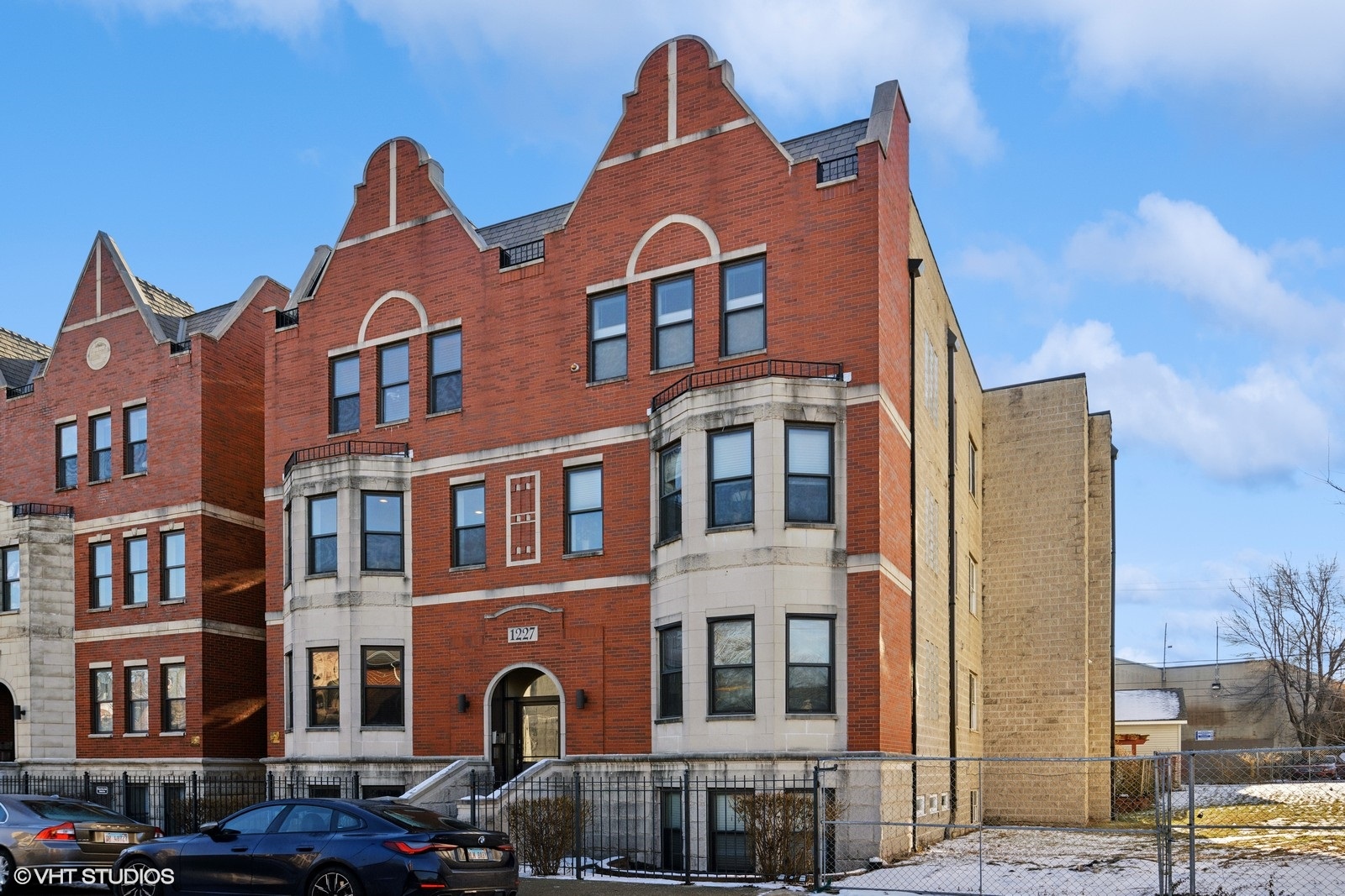 a front view of a building with a yard