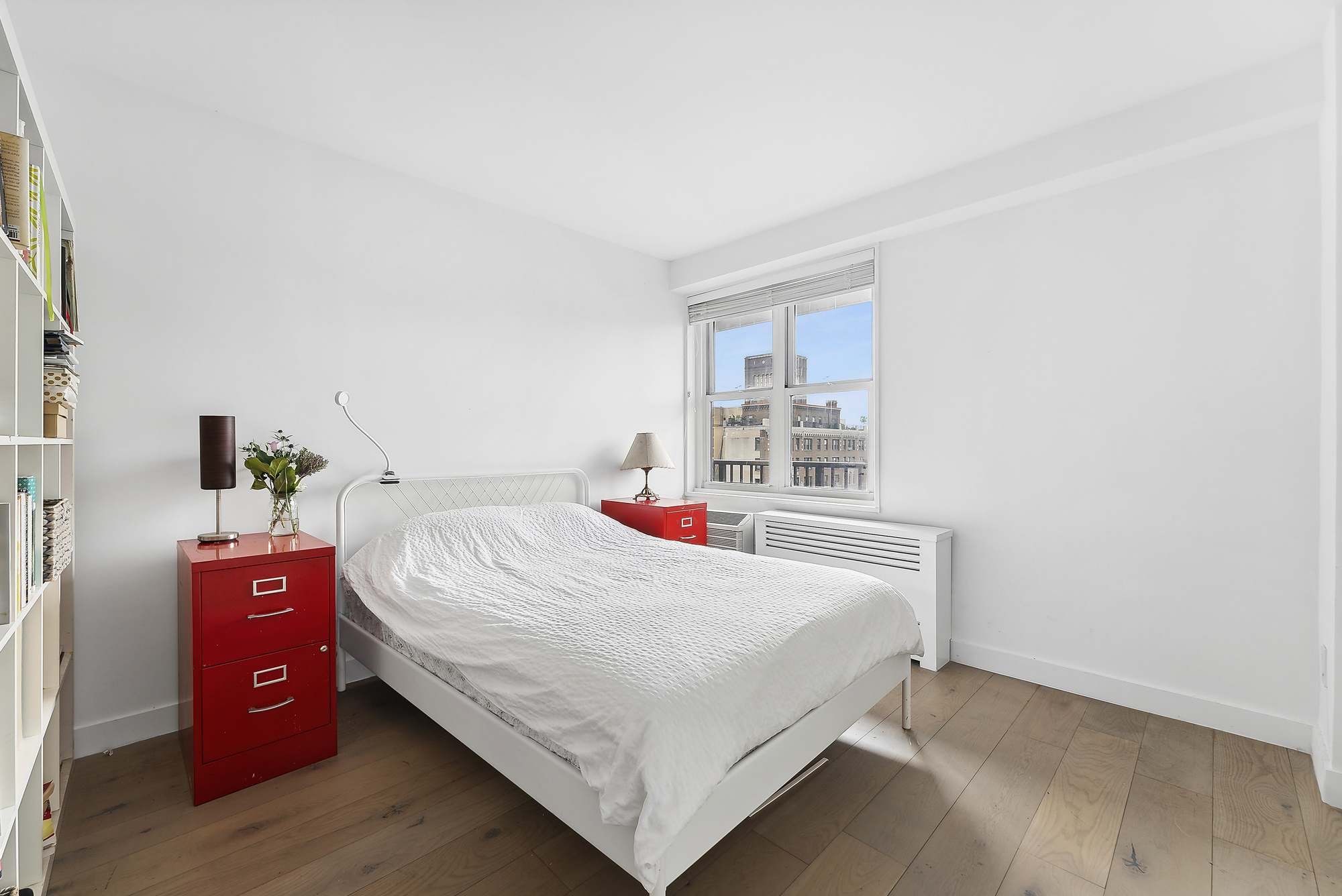 175 West 95th Street, Unit 18G Manhattan, NY 10025 - Photo 6 of 14 a bedroom with a bed and a window